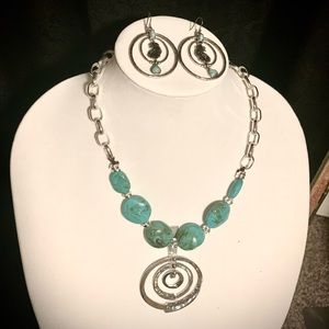 Turquoise and silver necklace and earring set.